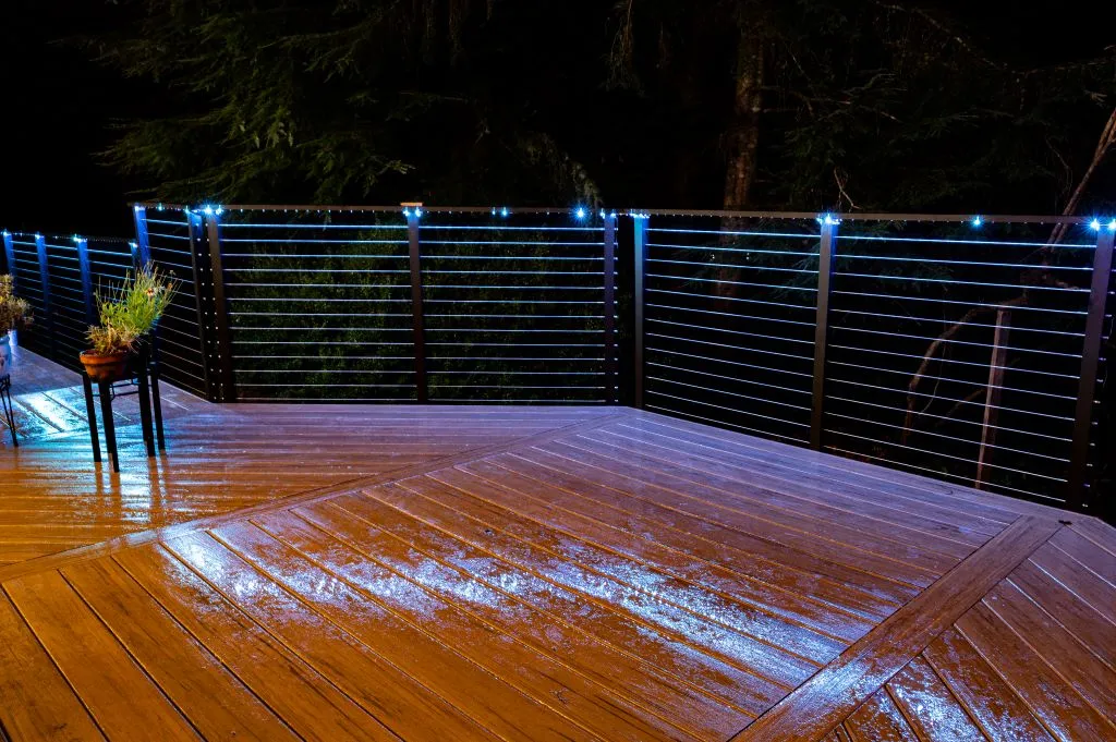 Cable railing with embedded lighting at night