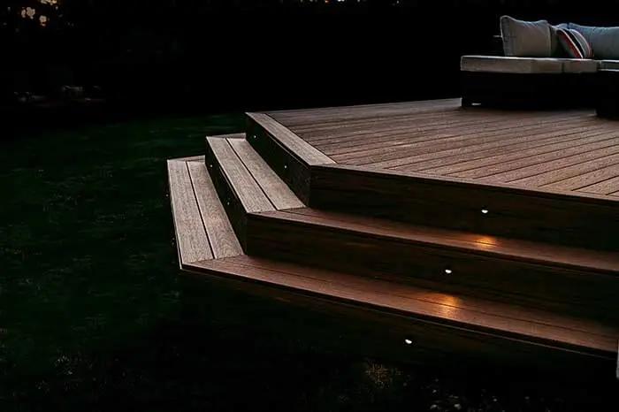 Outdoor lighting embedded into deck stairs