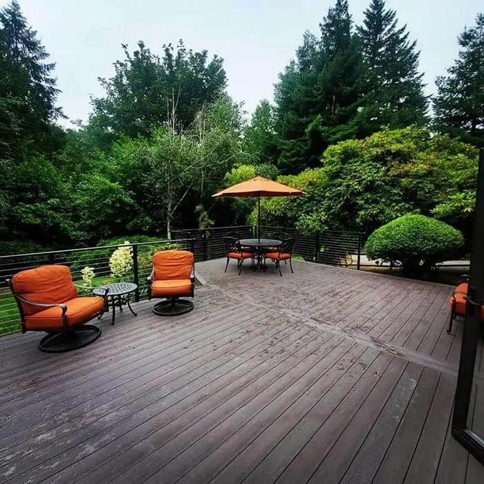 Bellevue deck balcony overlooking Seattle skyline with cable railing.