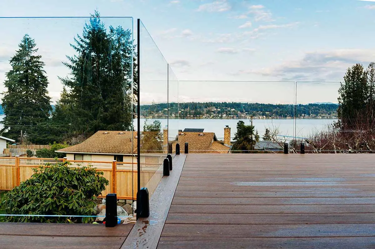 Balcony construction with frameless glass railing in Tacoma