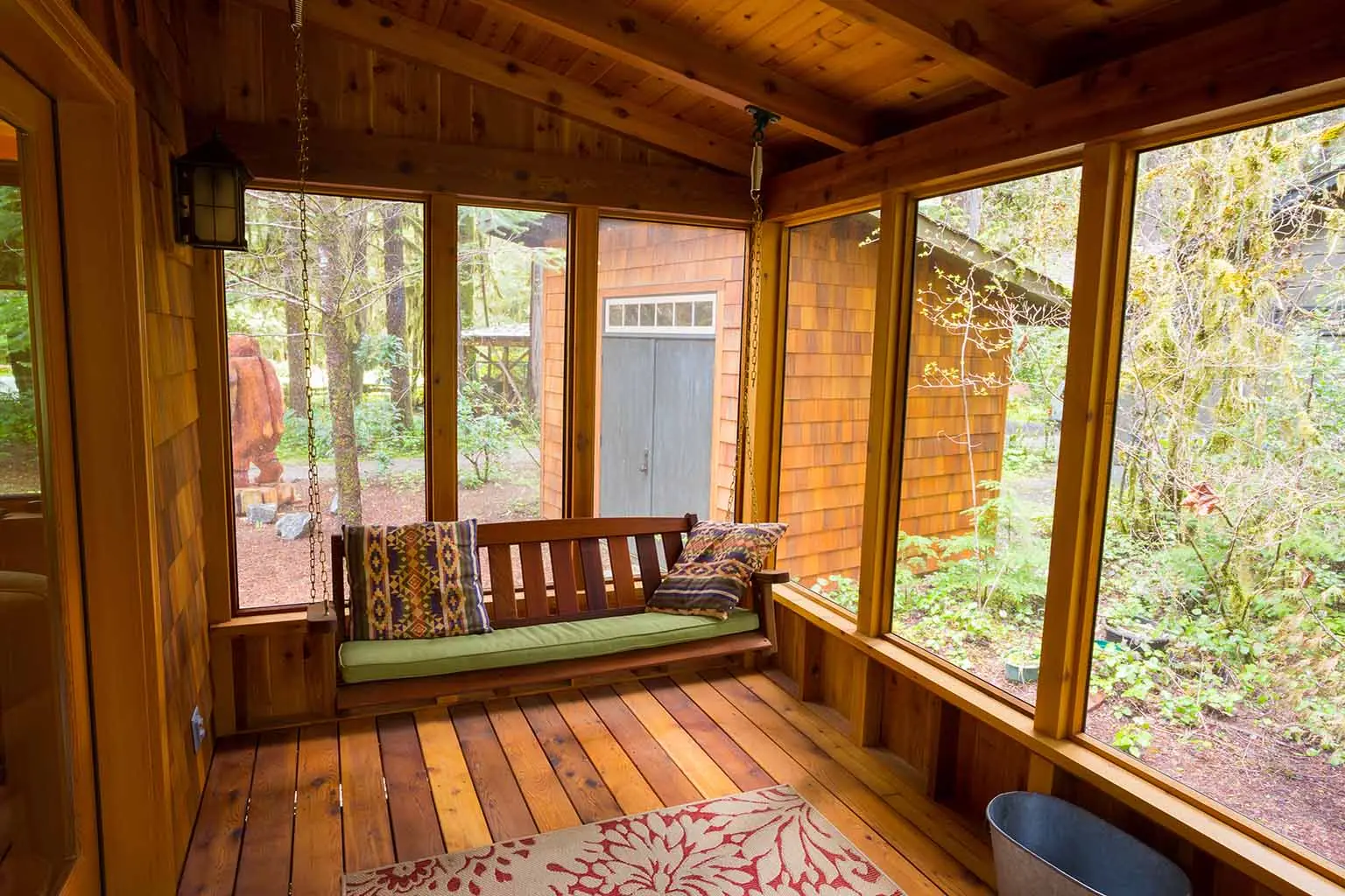 Sunroom with wood wall interior siding